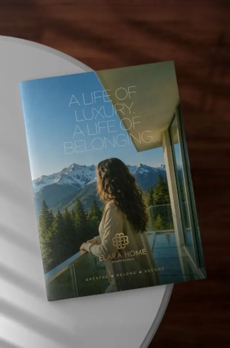 The printed Elara Home brochure resting on a table