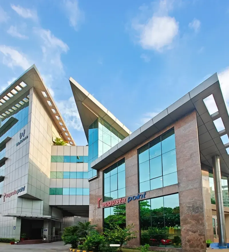 Augusta Point — stone and glass office frontage, Golf Course Road